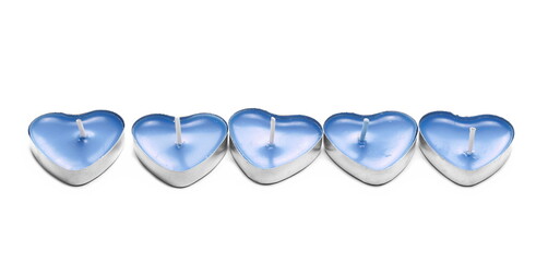 Tea light candles in shape heart aluminum candle holders isolated on white background
