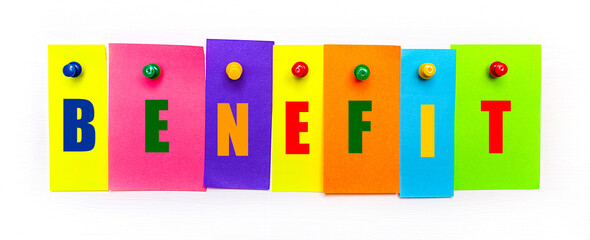 On a white background, buttons are used to fix bright multi-colored strips of paper with the text...