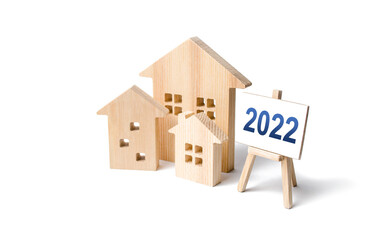 Residential buildings and easel 2022. Concept of real estate market in new year. Housing market...