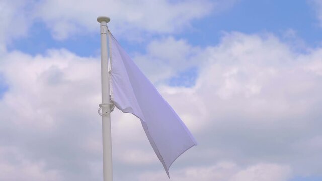 White flag waving in the wind in 4k slow motion 60fps