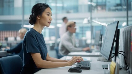 In Big Corporate Office: Portrait of Confident Beautiful Asian Manager Using Computer, Businesspeople and Experts Working Around Her, Analysing Statistics, Commerce Data, Marketing Plans. - Powered by Adobe