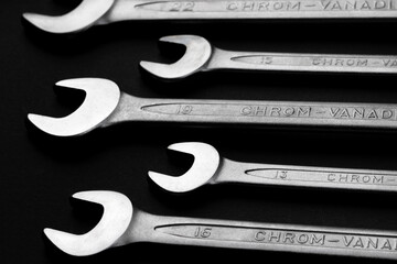 Steel wrenches from chrome vanadium steel on black background closeup. Selective focus