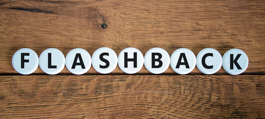 Flashback symbol. The concept word Flashback on white circles. Beautiful wooden table, wooden background. Business and flashback concept. Copy space. - obrazy, fototapety, plakaty