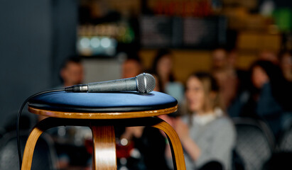microphone lies on a chair on the stage before the performance - obrazy, fototapety, plakaty