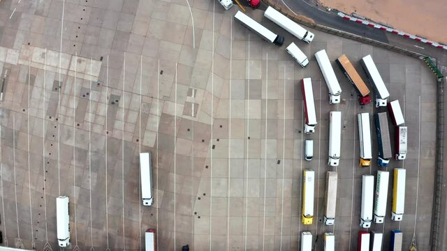 Aerial view of harbor and trucks parked along side each other getting ready for embarking the Dover Ferry to Calais