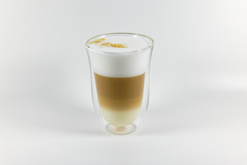 transparent termos cup with latte, white foam and brown coffee against white background, with shading, studio shot