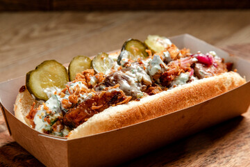 fast food hot dog with smoked minced meat and pickled cucumbers