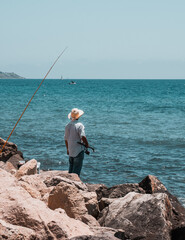 spanish fisherman in alicante waiting in the mediterranean sea spain