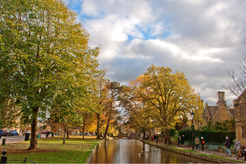 Obraz premium Autumn Trees Bourton on the Water Cotswolds Gloucestershire
