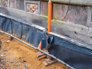 Moisture protection on a house is being renewed