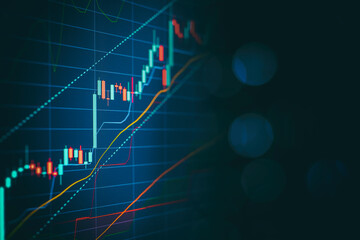 Close up financial chart with uptrend line graph in stock market on defocused blue color bokeh background