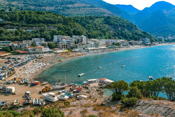 View from the mountain to the coast and the beach of the town of Sutomore in Montenegro. Adriatic sea, summer, tourists