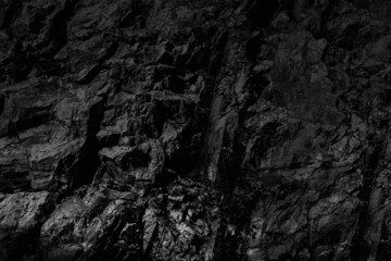 Grungy cragged bumpy pitted cavity stone facade, split layer gap.Ruined cracked shattered worn rough hiking canyon.Old ragged grunge steep marble cliff. Grand vintage crannied damaged impressive gorge