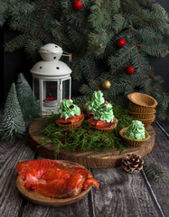 Christmas appetizer dish. Tartlets with salmon and cream cheese. Christmas food. Selective focus - 469966772