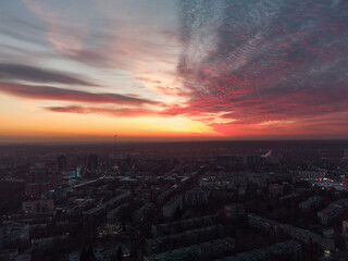Aerial scenic vivid colorful sunset view with epic skyscape. Kharkiv city center, Pavlove pole residential district streets in evening light