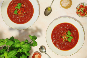 Plates with traditional gazpacho tomato soup