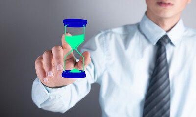 man clicks on virtual hourglass