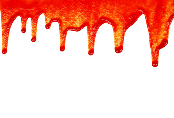 Red ketchup dripping on white background