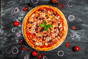 Pizza Quatro stagione with tomato sauce, salami, mushrooms, mozzarella, bacon, olives.