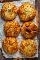 Traditional fried pies from Romania with potatoes, cheese and cabbage. Romanian food.