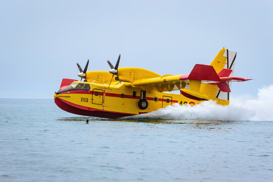 Firefighting seaplane collecting water in the sea.