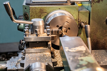 Bronze hexagon in a lathe chuck.