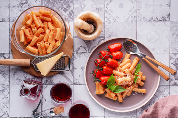 pasta with tomatoes. basil and grated parmesan