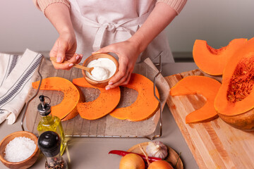 The girl prepares a dish for the holiday thanksgiving day