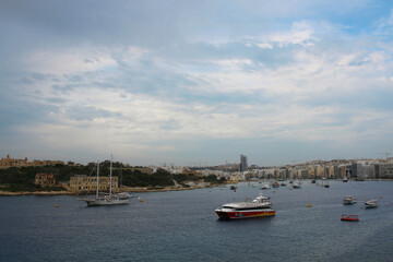 Fototapeta premium Boats in the Grand Harbour in Valletta city, Malta
