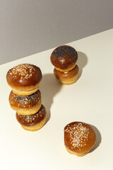 Assortment of small round brioche buns with homemade seeds