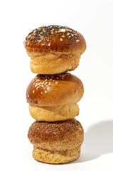 Assortment of small round brioche buns with homemade seeds