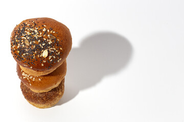 Assortment of small round brioche buns with homemade seeds