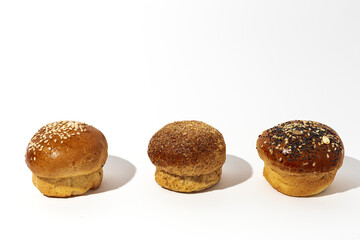 Assortment of small round brioche buns with homemade seeds