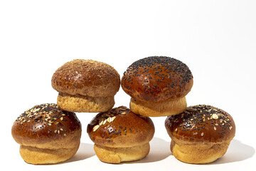 Assortment of small round brioche buns with homemade seeds