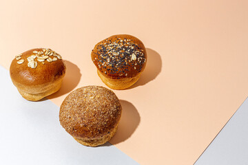 Assortment of small round brioche buns with homemade seeds