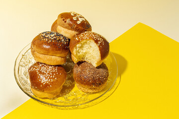 Assortment of small round brioche buns with homemade seeds