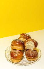 Assortment of small round brioche buns with homemade seeds
