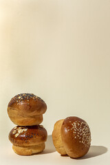 Assortment of small round brioche buns with homemade seeds