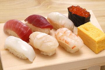 Japanese sushi on wooden board called 