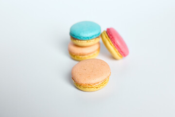 Macaroons lie on a white background
