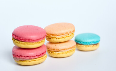 Macaroons lie on a white background