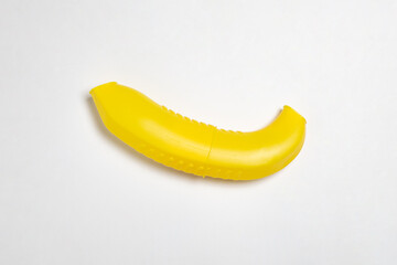 Plastic yellow lunch banana case isolated on white background.High-resolution photo.Mock up