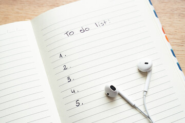 To do list, notebook, notes, headphones, calendar