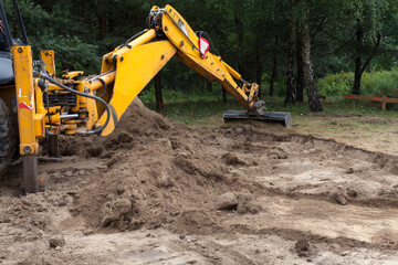 Excavator at work on the construction of a new home