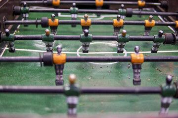 Close-up of Table football soccer game on green field. Horizontal