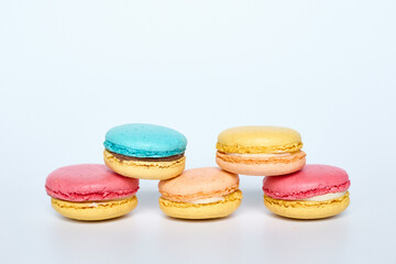 Macaroons lie on a white background