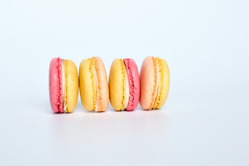 Macaroons lie on a white background