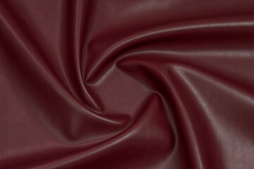 red artificial leather with waves and folds on PVC base