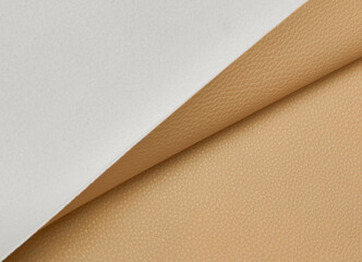 beige artificial leather with waves and folds on PVC base