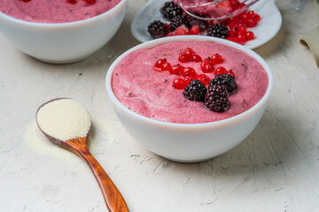 Healthy semolina pudding with red currant berries. Vegan dessert.